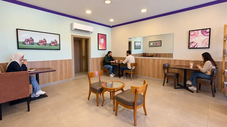 Al Salam Street – Naour indoor seating · another view